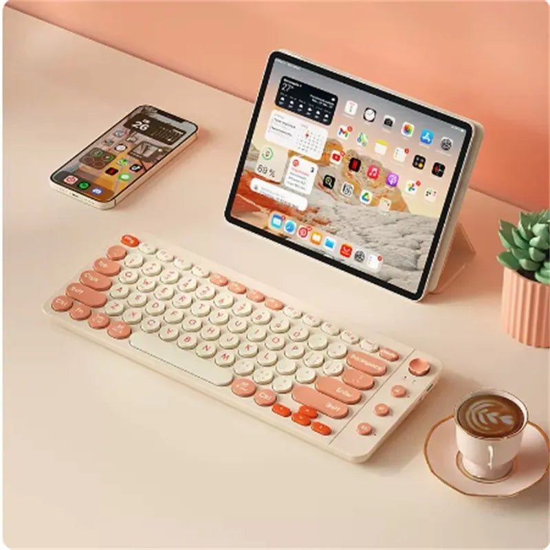 Three-mode wireless keyboard and Bluetooth mouse set in Star Purple colour on desk with laptop