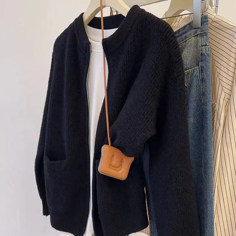 Beige viscose fibre soft sweater coat with long sleeves and open cardigan front.
