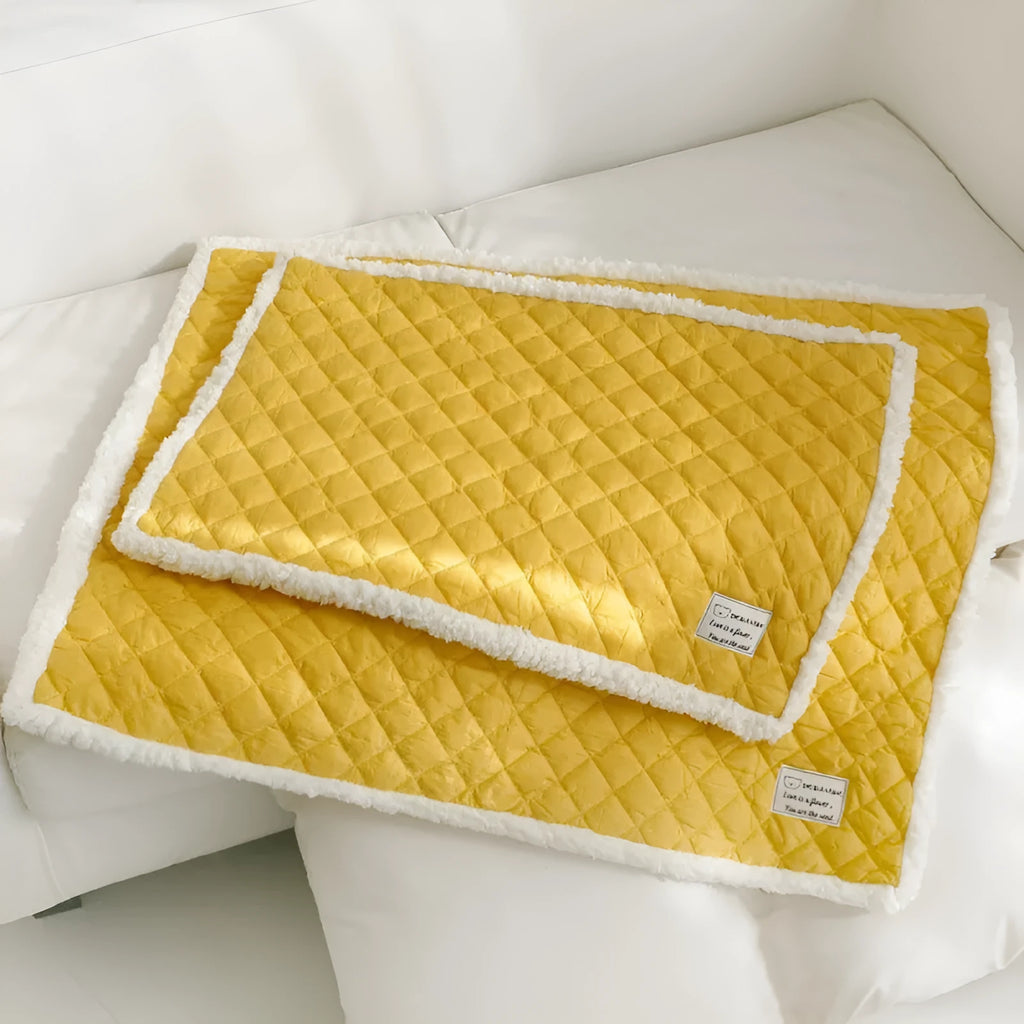 Quilted blue cloth pet blanket for cats shown in a large 80x60cm size.