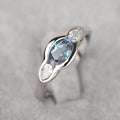 Geometric ellipse ring with zircon stones in white gold finish showing elliptical shape