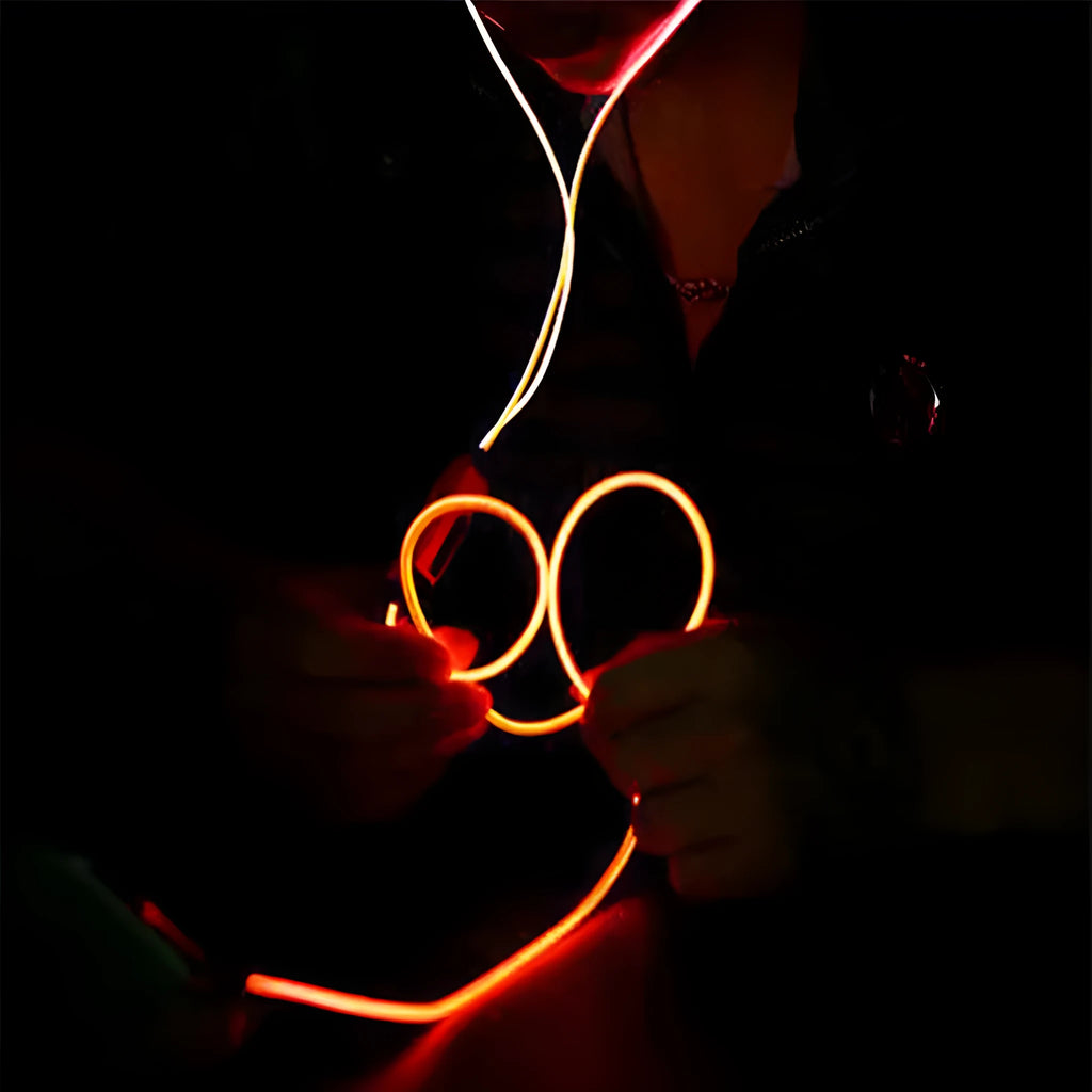 Blue LED light-up earphones with aluminium alloy shells and a 3.5mm plug, showing illuminated EL lines.