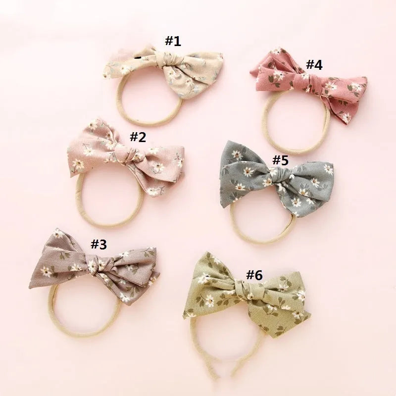 Children's cloth hair band with knotted bow design showing Snow White princess pattern