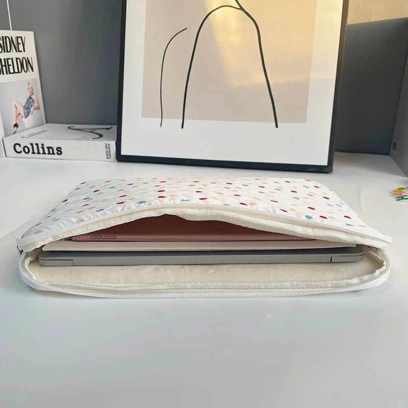 Women's polka dot polyester laptop bag shown in solid colour, suitable for 11-inch to 15.6-inch devices.