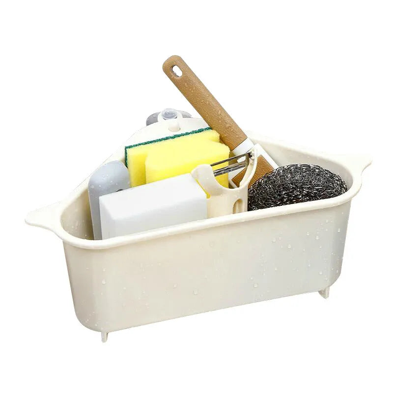 Beige and blue plastic triangle sink storage rack with suction cups holding a sponge