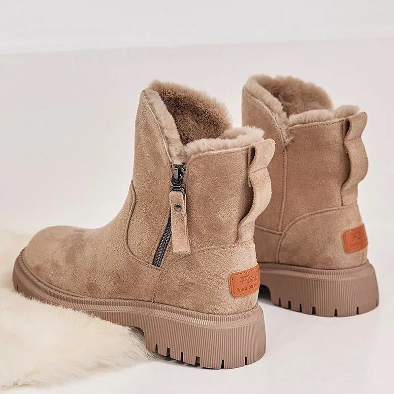 Women's black thick plush snow boot with side zipper and round toe on a rubber sole.