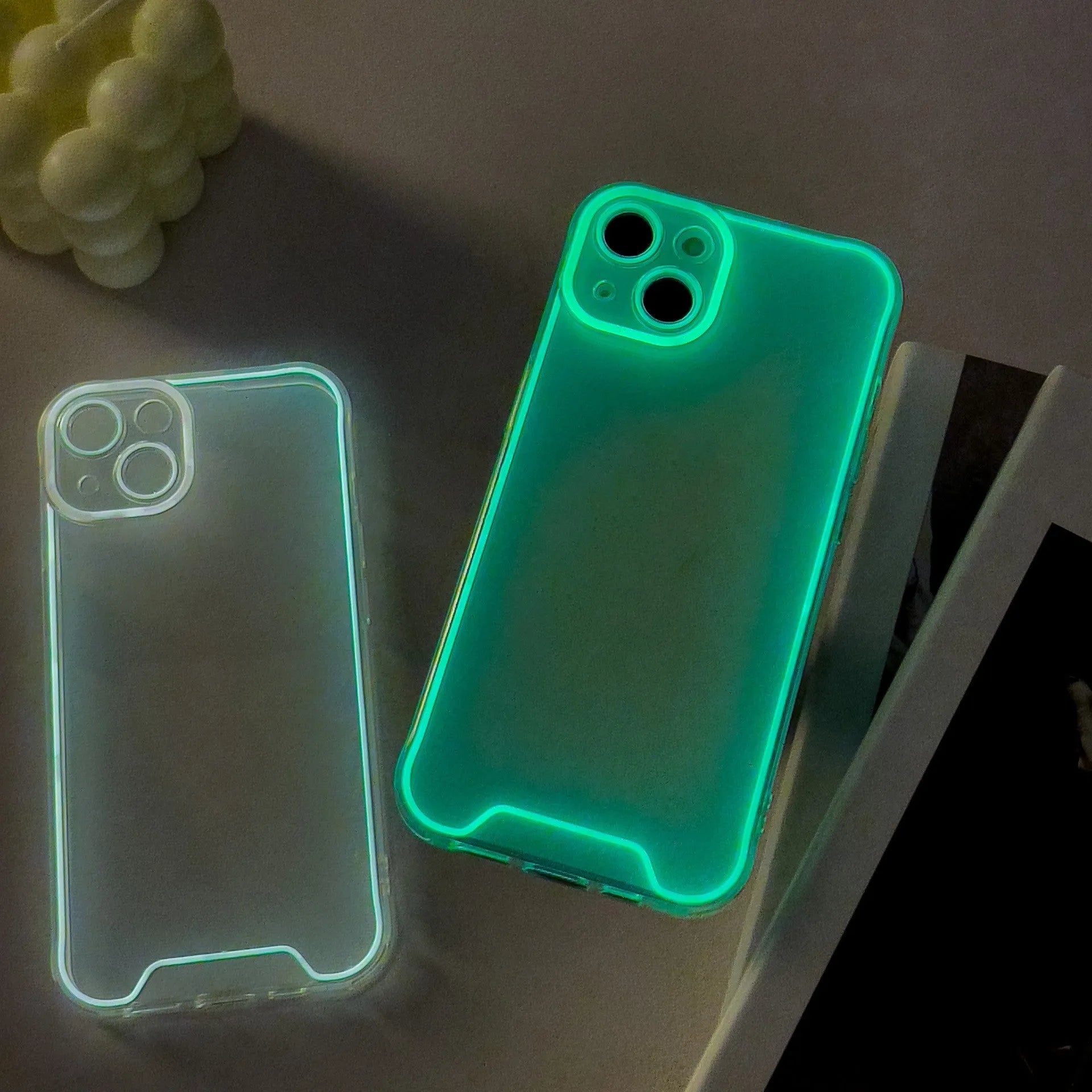 Green glow in the dark soft TPU Christmas phone case for Apple iPhone on a dark background.