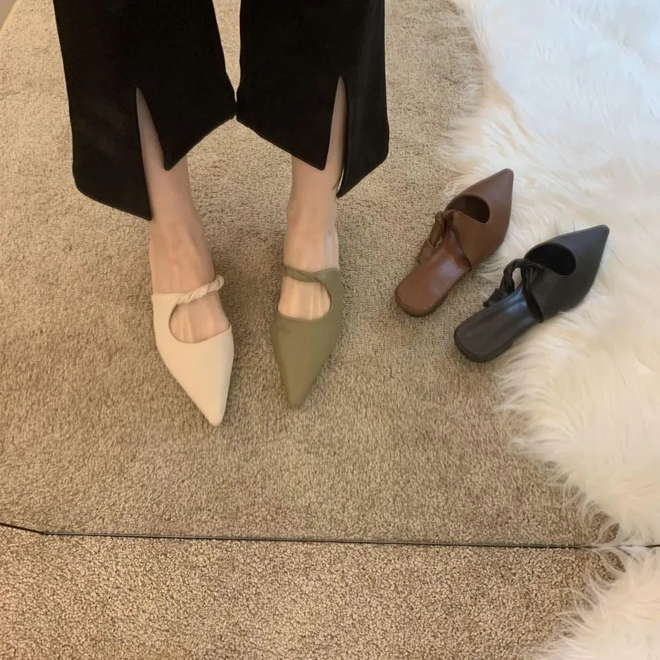 Women's semi-toe box slippers with leather lining and rubber sole in four colour options.