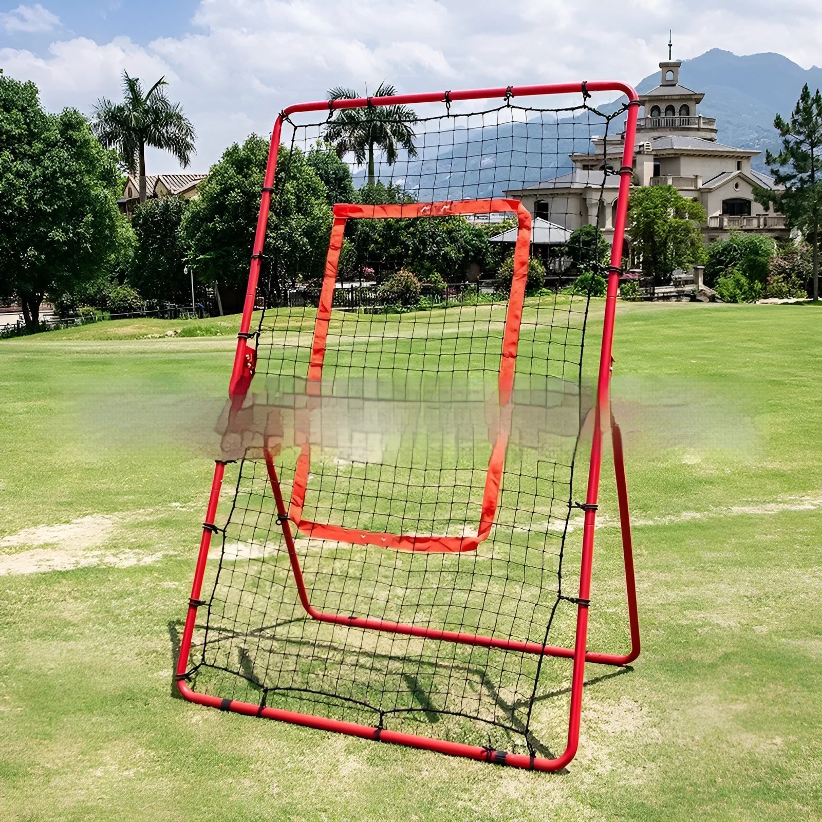 Red adjustable baseball training net with metal frame set up in a garden.