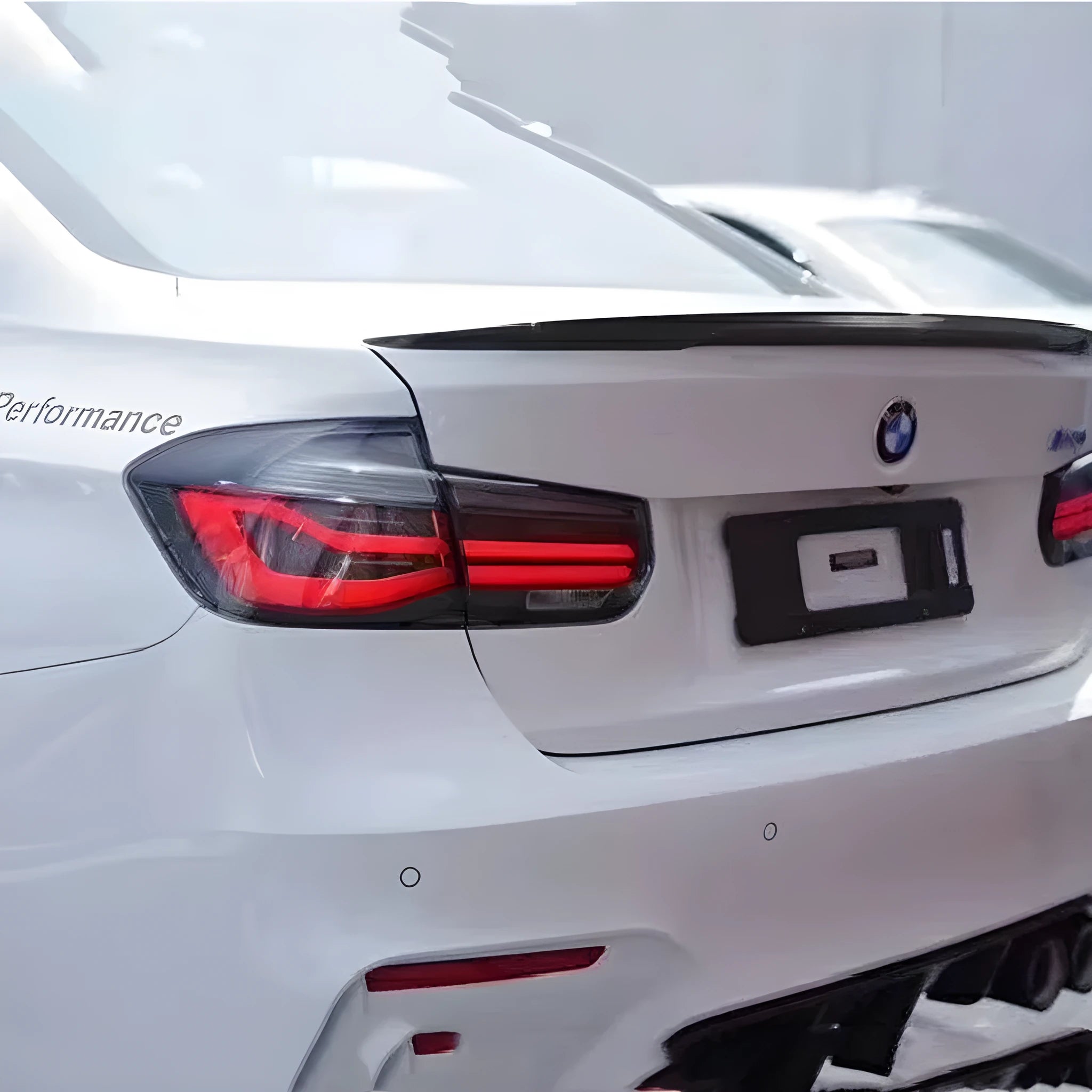 BMW 3 Series modified LED tail light assembly with streamer steering in red or smoked black finish