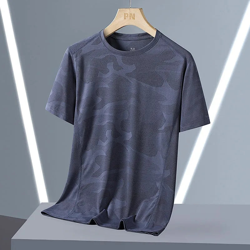 Plus size men's camouflage print short sleeve top in nylon fabric on a hanger.