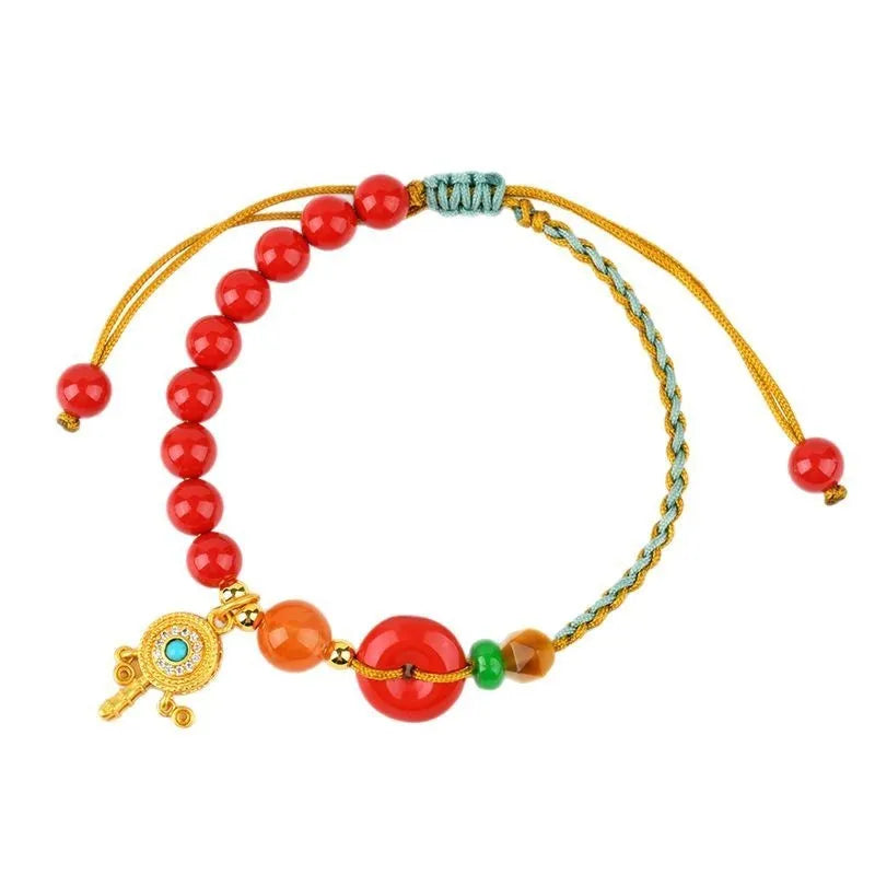 Cinnabar peace buckle woven bracelet in emperor red sand colour with hand-woven geometry design