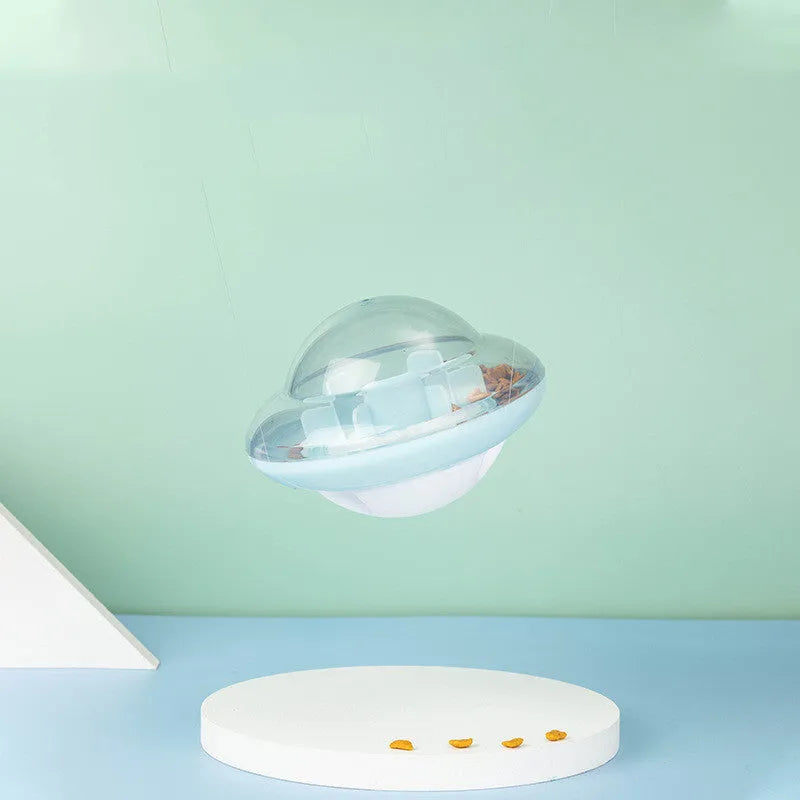 Blue pet tumbler ball toy with clear visual cabin and labyrinth column on floor