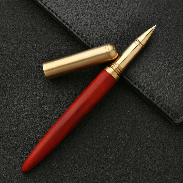 Brass and sandalwood signature pen with wooden barrel, shown alongside a ruler indicating 14 cm length.