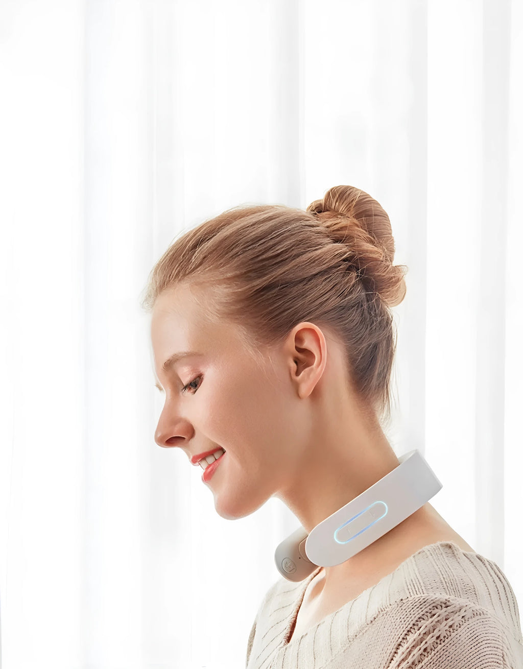 White electric acupressure massager for back neck and shoulder pain relief with control buttons.