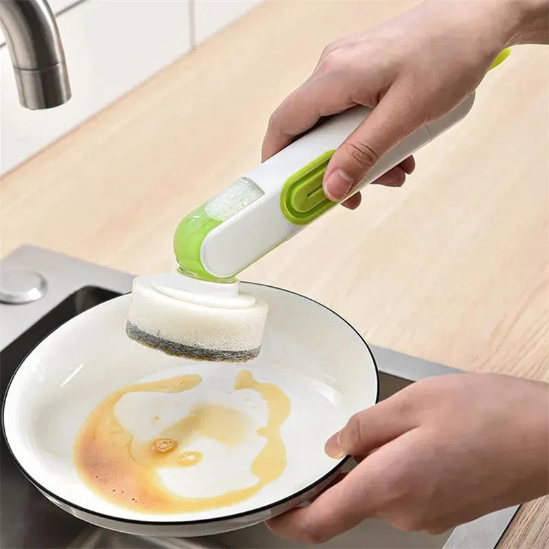 Long-handle kitchen cleaning brush with liquid dispenser and two brush heads in white and green colour