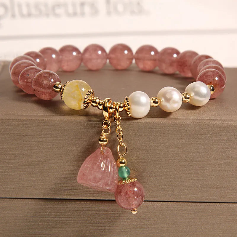 Women's multi-layer crystal bracelet with natural garnet, strawberry quartz pendants, and jinsi jade beads in assorted colours.