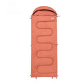 Ochre and olive green ultra-light cotton sleeping bag quilt for camping, shown folded and portable.