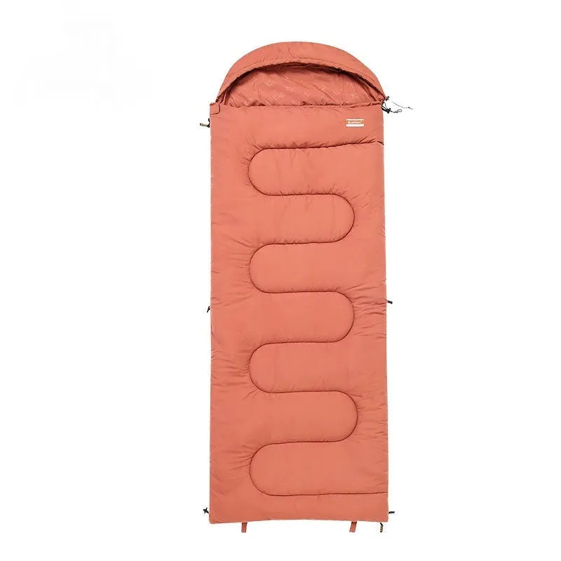 Ochre and olive green ultra-light cotton sleeping bag quilt for camping, shown folded and portable.