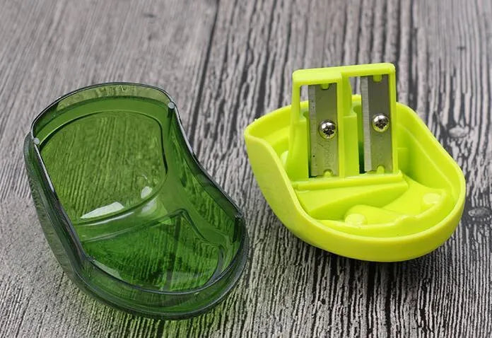 A single hole manual pencil sharpener with a double aperture design for different pencil thicknesses.