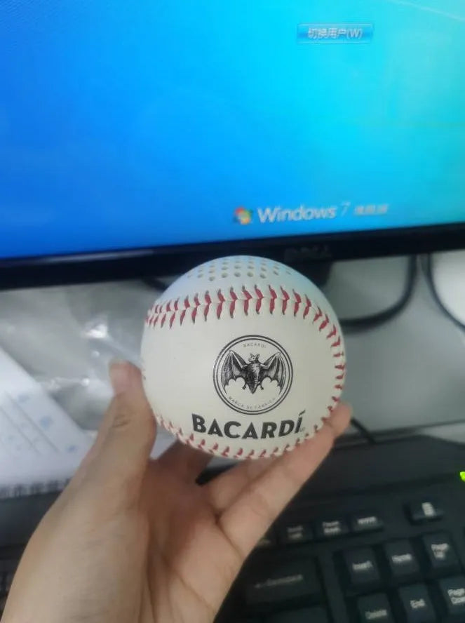 Baseball-shaped Bluetooth speaker in green, orange, or white colours with USB charging port