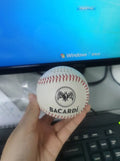 Baseball-shaped Bluetooth speaker in green, orange, or white colours with USB charging port