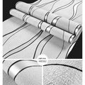 Close-up of textured curve stripe pattern on dark brown 3D decorative wallpaper roll.