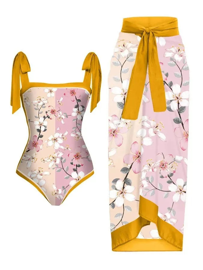 Women's printed chiffon two-piece swimsuit with attached hip skirt in a floral pattern.