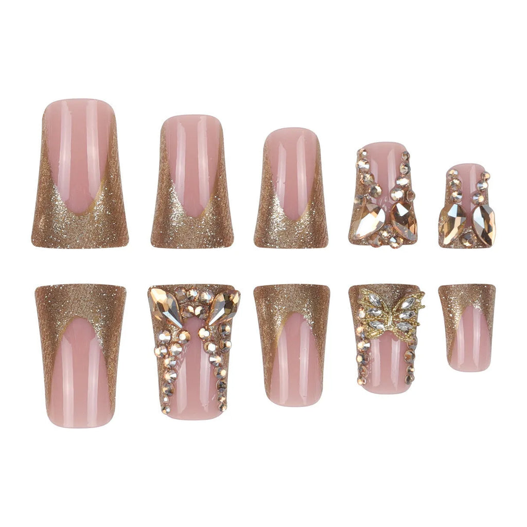 Pack of 24 golden diamond and debris-style butterfly nail stickers with a bottle of glue.