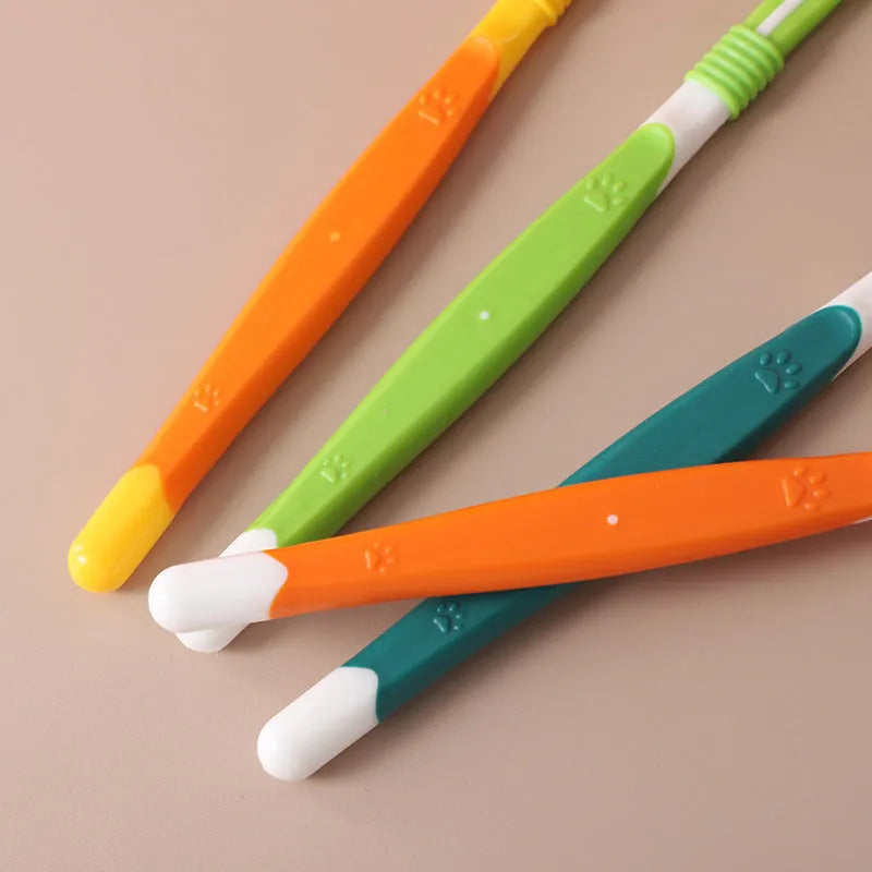 Pet toothbrush with angled head in assorted colours including orange, dark green and blue pink