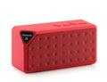 Small cube-shaped Cannon X3 portable Bluetooth speaker in multiple colour options on a table.