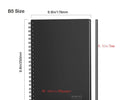 Rewritable paper notebook with black PP cover, spiral binding, and erasable pen on a desk