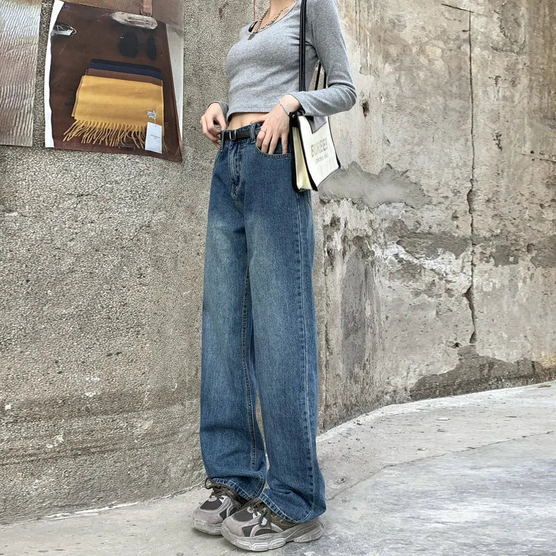 Women's high waist straight leg jeans in retro blue colour on a hanger.