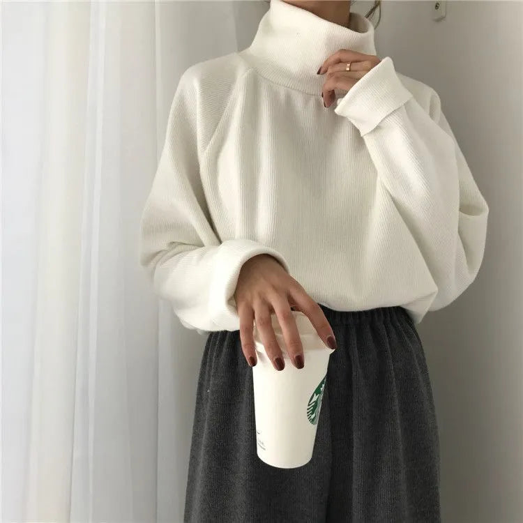 Women's solid colour loose top with a half-high collar and long sleeves in apricot.