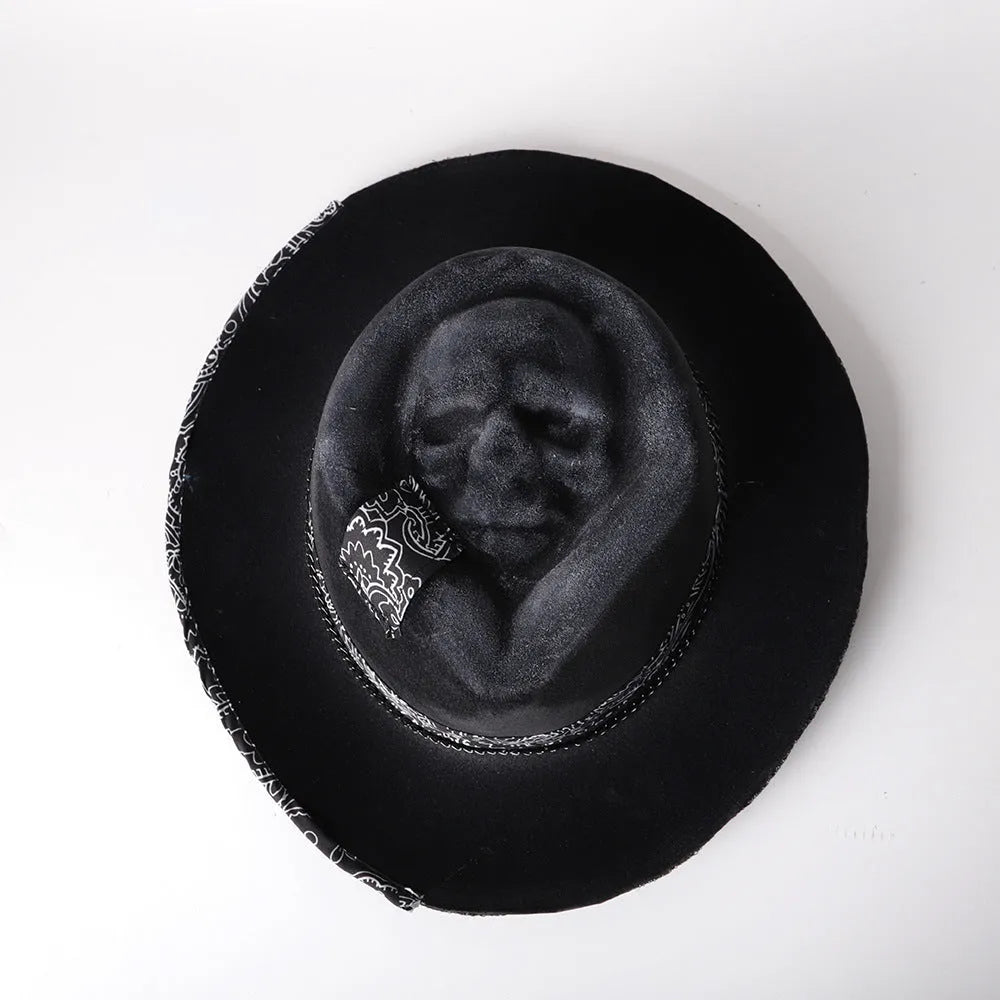 Handmade conical skull hat crafted from wool felt and denim fabric in a dark colour.