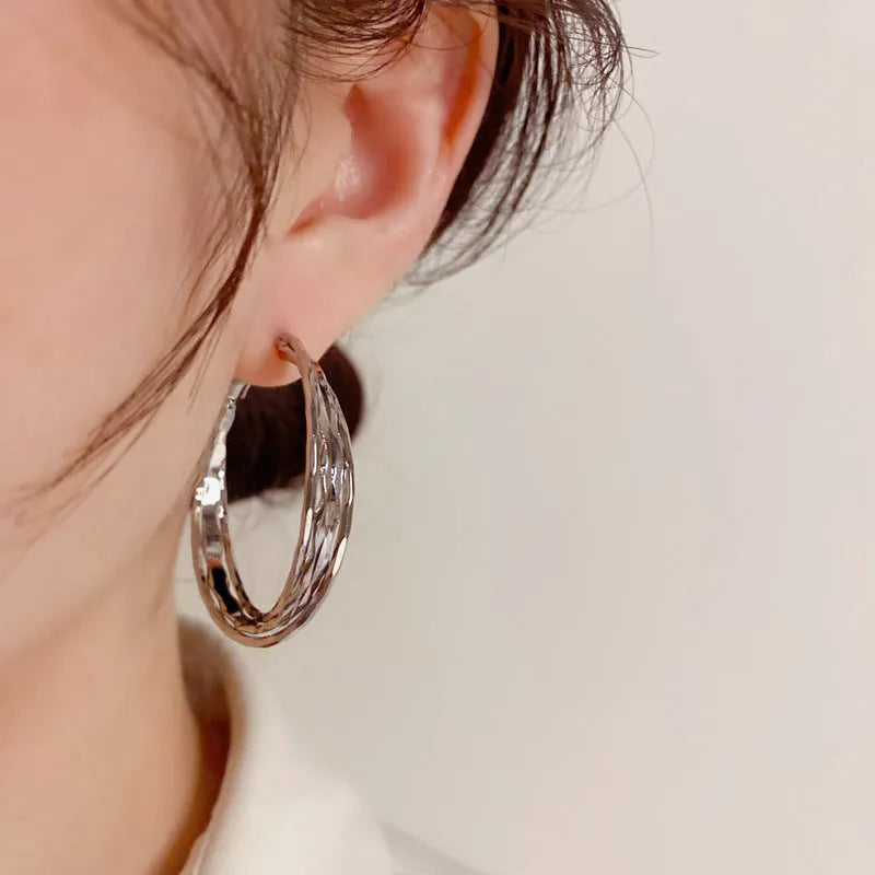 Silver Needle fashion simple metal twisted earrings in gold electroplated finish on copper base, round geometric shape