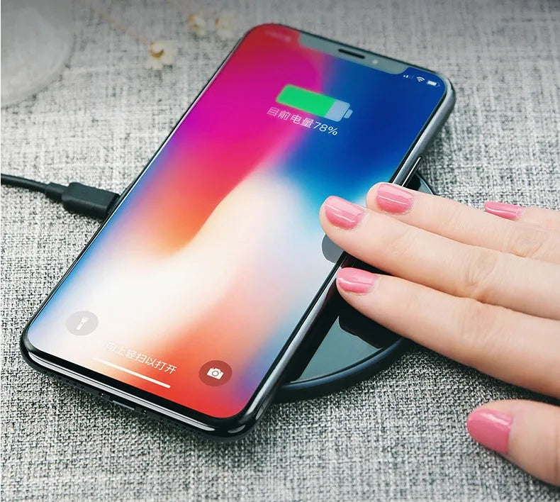 Glass disc wireless charger showing black and white colour options with charging indicator