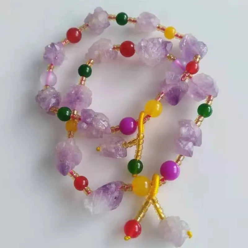 Natural shaped purple amethyst bead bracelet with a fu character charm for women.