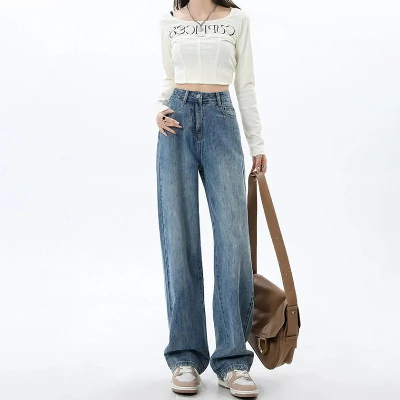 Woman wearing retro blue high-waisted wide-leg jeans with a straight-leg cut.