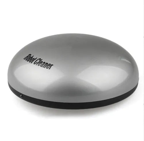 Silver-coloured compact automatic sweeping robot vacuum cleaner on a wooden floor.