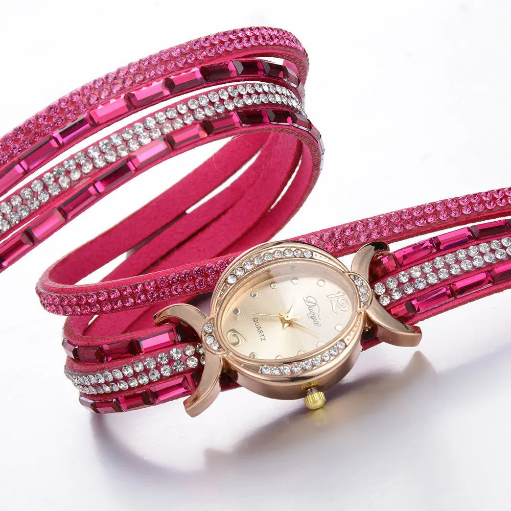 Women's casual rhinestone watch with round stainless steel case, leather band, and 25mm dial