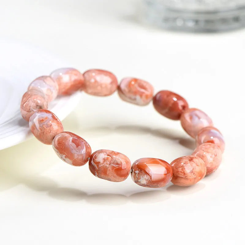 Natural cherry agate barrel bead bracelet with 10x14mm ruyi motifs geometric design