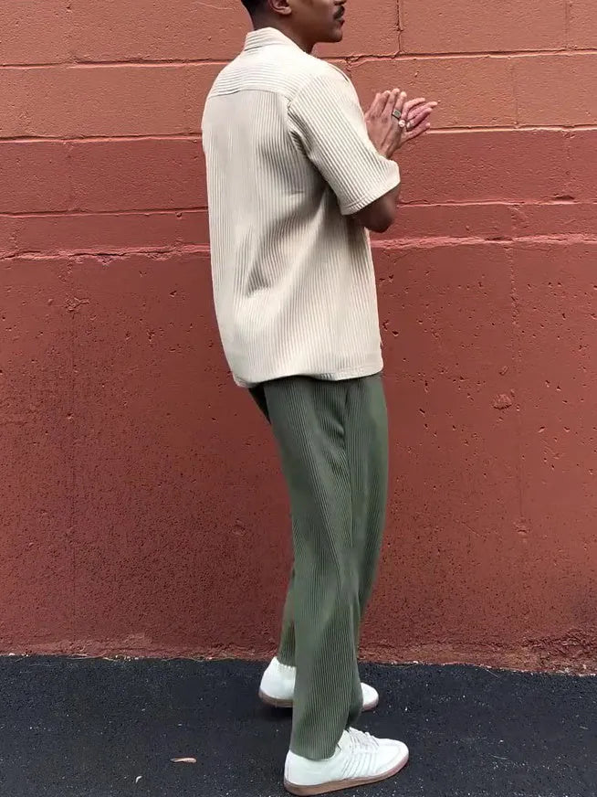 Men's green pleated casual trousers with ankle-length cut and regular fit