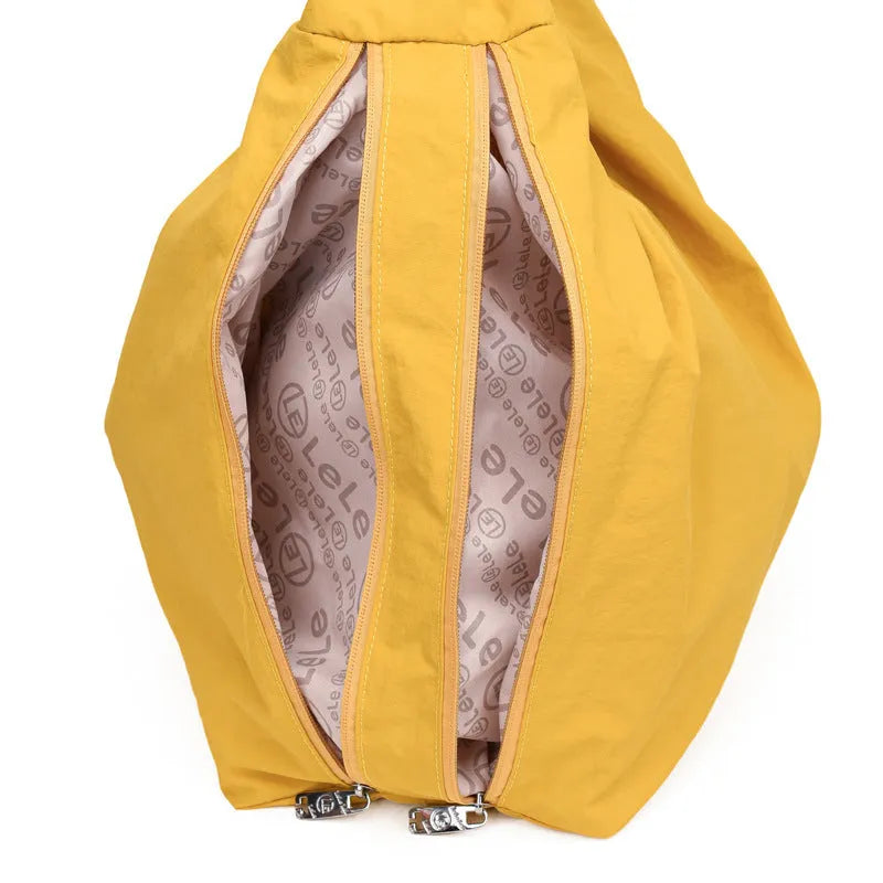 Women's heart-shaped nylon underarm bag in black, blue, khaki, and yellow colour options