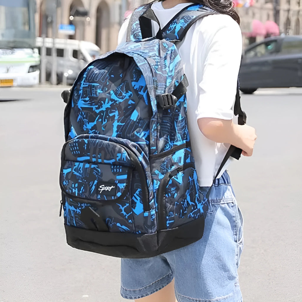 Blue large capacity nylon backpack with padded straps on a plain background