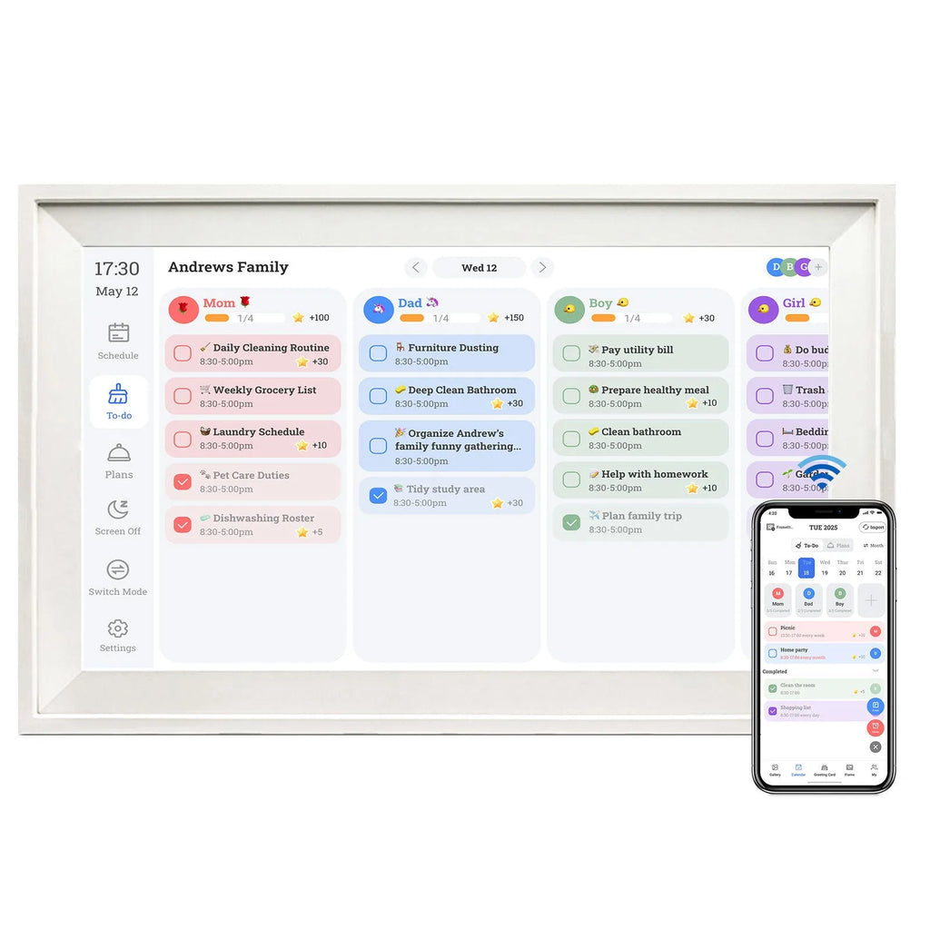 White 15.6 inch smart digital photo frame on a table showing a family photo, with mobile app upload icon.