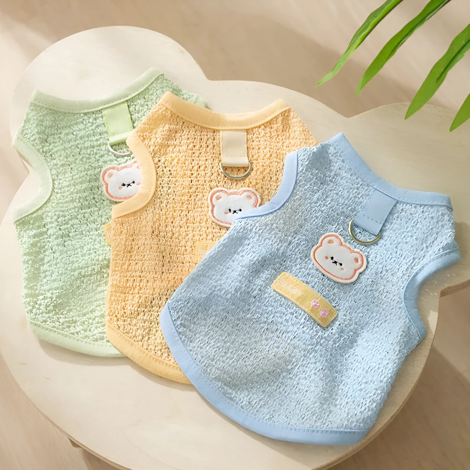Hollowed-out knitted cat clothes with bear patch in blue, green, yellow colours