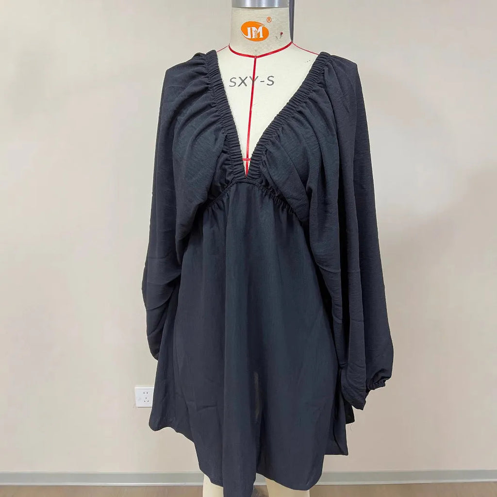 Women's apricot V-neck midi dress with long puff sleeves and a flounced skirt.