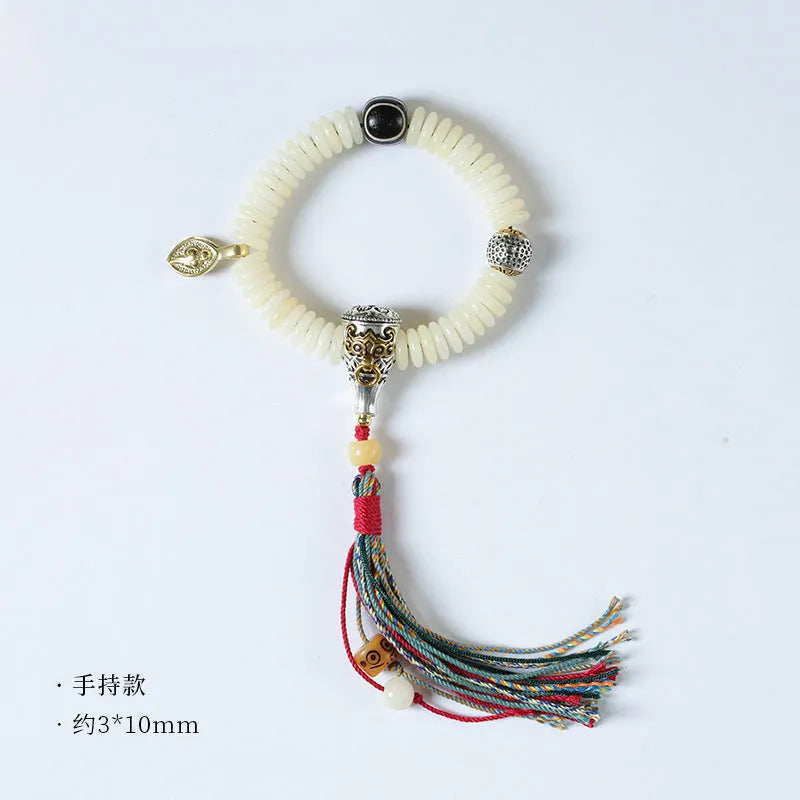 White Bodhi seed Tibetan bracelet showing 3x10mm dimensions in bracelet and handheld styles