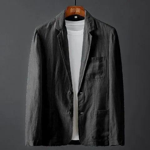 Men's slim fit solid colour linen-style suit jacket with nine-point sleeves on a hanger.