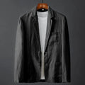 Men's slim fit solid colour linen-style suit jacket with nine-point sleeves on a hanger.